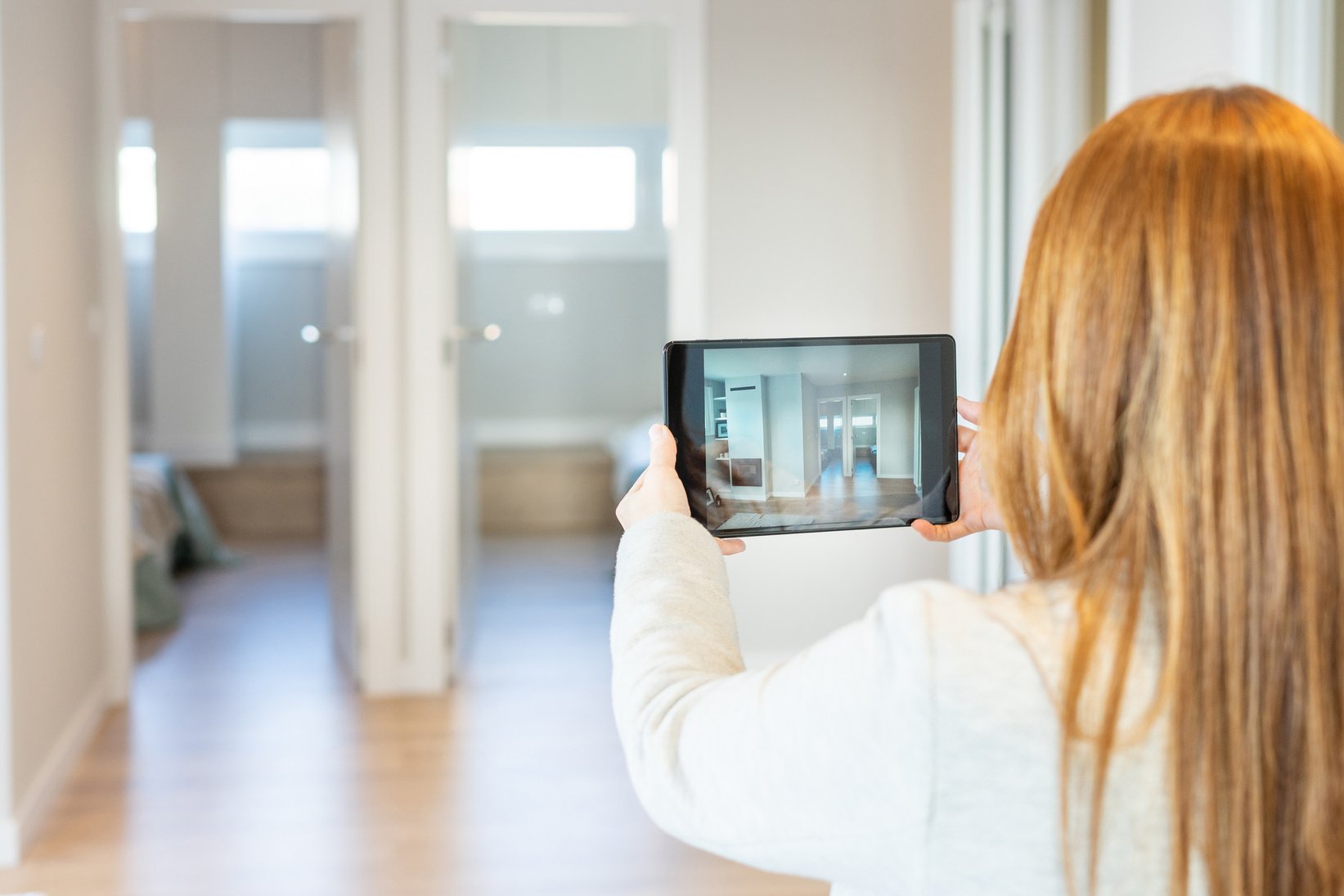 Real estate agent conducts virtual tour to show a property to clients via video call