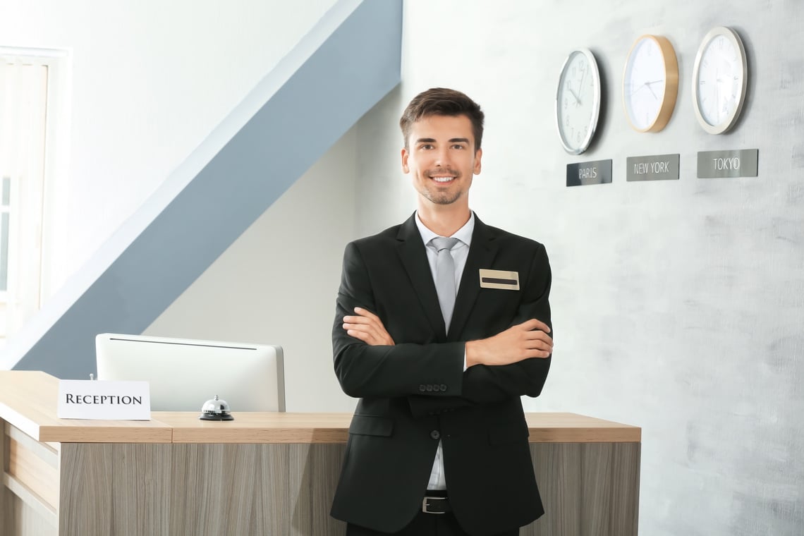 Male Receptionist Working in Hotel